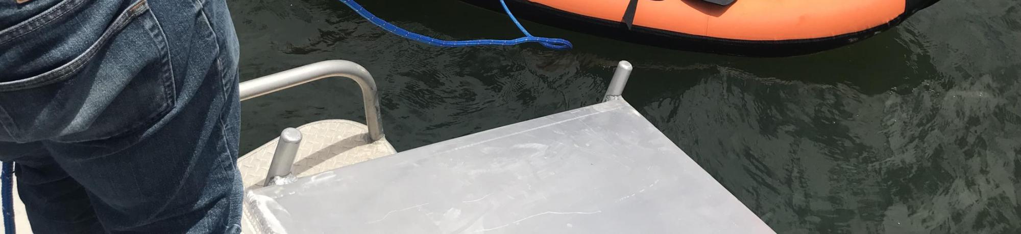 Seining for mooring ball with inflatable kayak